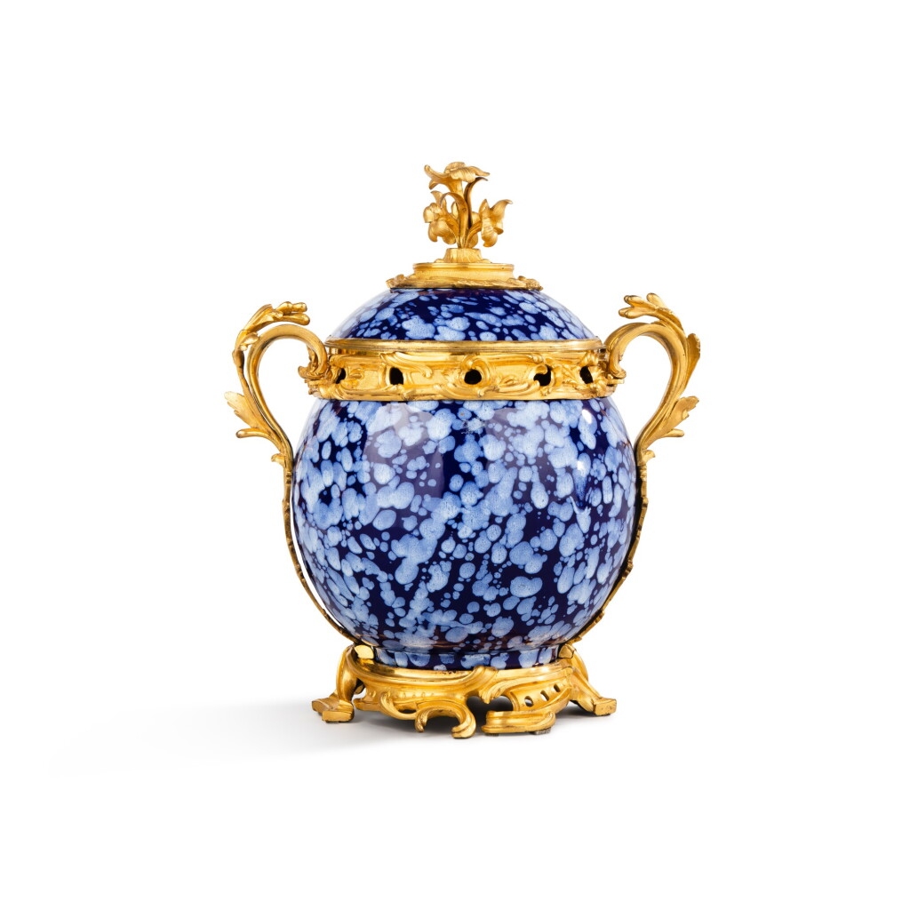 View full screen - View 1 of Lot 30. A gilt-bronze mounted Nevers faïence pot-pourri vase, the faïence first half 18th century, the mounts Louis XV, circa 1755.