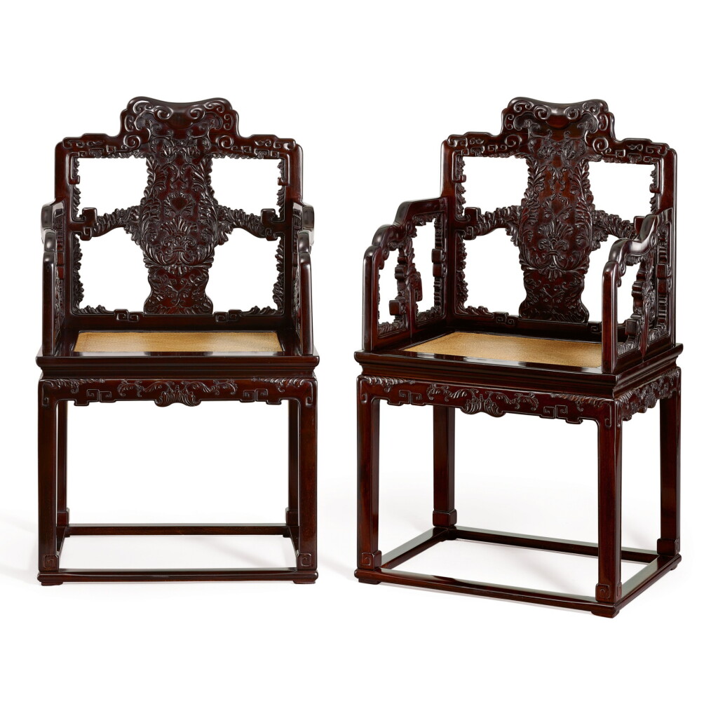 View full screen - View 1 of Lot 113. A RARE PAIR OF ZITAN MASTER'S ARMCHAIRS, TAISHIYI QING DYNASTY, QIANLONG PERIOD | 清乾隆 紫檀雕西洋花束腰帶托泥扶手椅成對.