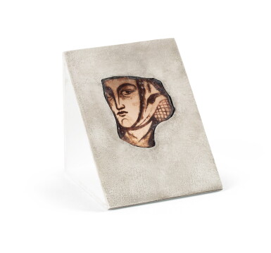 View full screen - View 1 of Lot 254. Probably French, 13th century, A Fragment of Stained Glass depicting a female Profile with headdress.