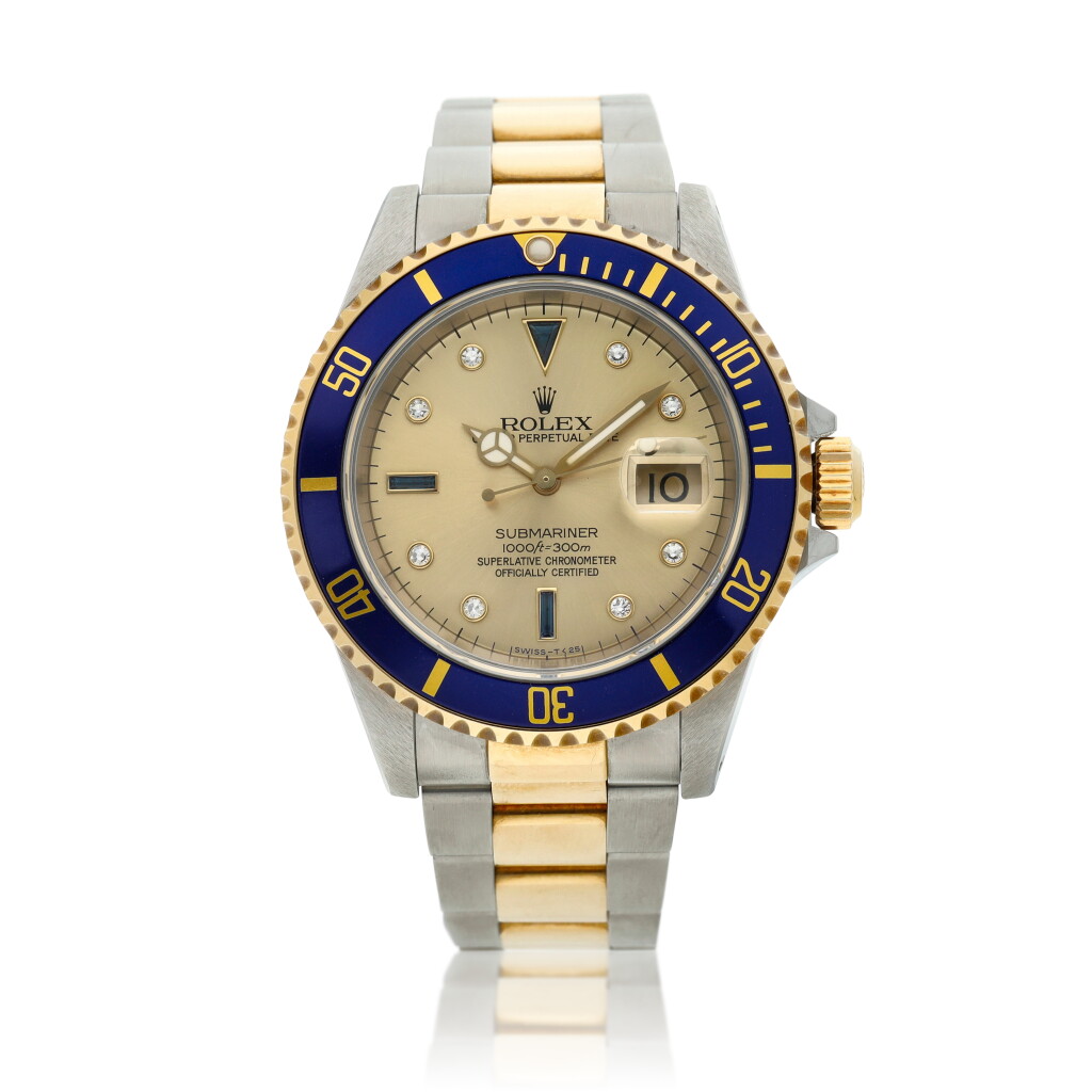 View full screen - View 1 of Lot 9. Reference 16613 Submariner A yellow gold and stainless steel wristwatch with date, bracelet and diamond and sapphire-set indexes, Circa 1990 .