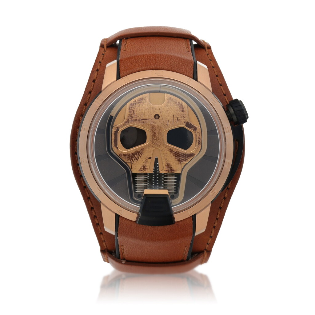 View full screen - View 1 of Lot 23. Skull Limited edition PVD-coated titanium and pink gold semi-skeletonized wristwatch with fluid retrograde hours and power reserve indication Circa 2020.