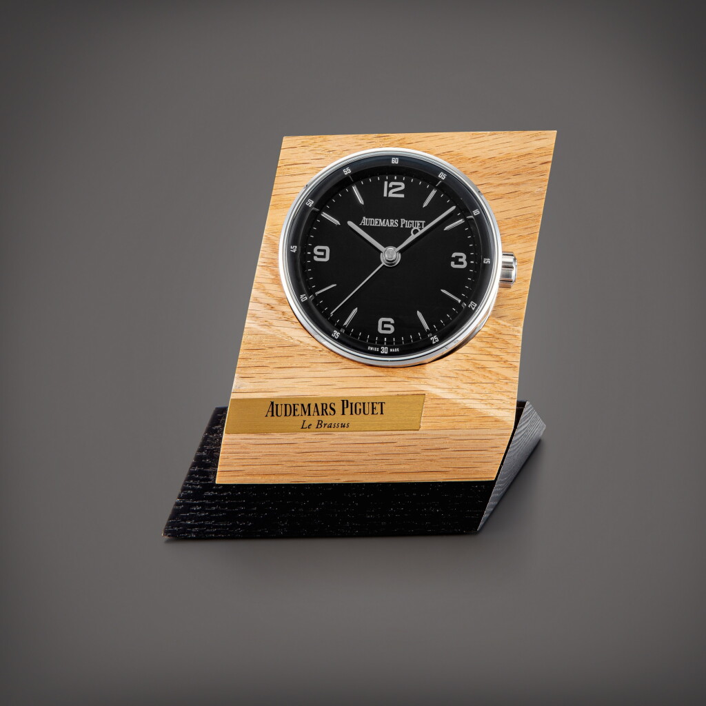 View full screen - View 1 of Lot 846. Code 11.59 | A stainless steel alarm desk clock with wooden stand, Circa 2019 | 愛彼 | Code 11.59 | 精鋼鬧鐘,備木製展示座,約2019年製.