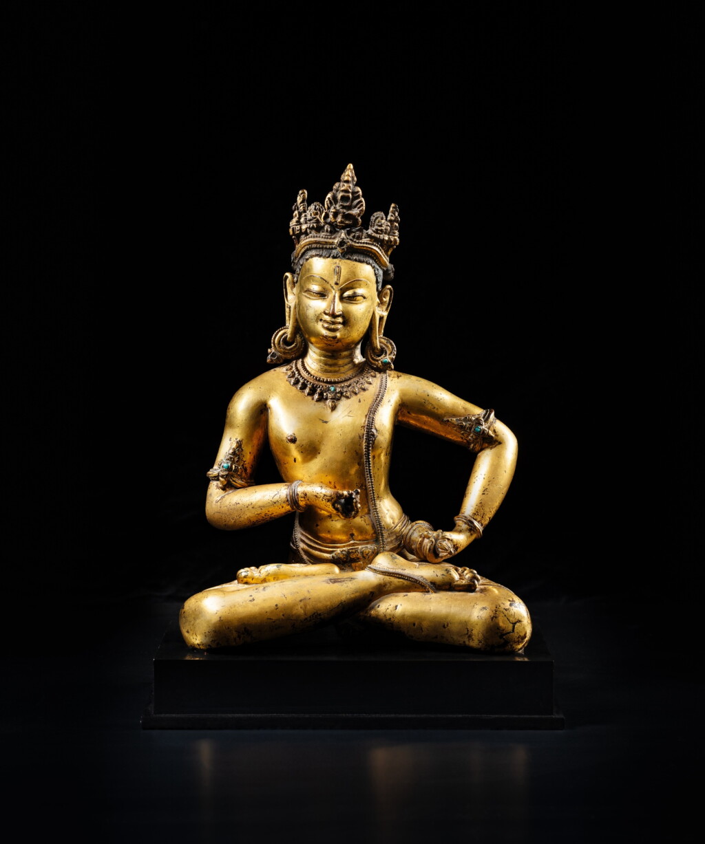 View full screen - View 1 of Lot 208. A rare gilt-copper figure of Vajrasattva, Nepal or Tibet, Khasa Malla Kingdom, 13th - 14th century | 十三至十四世紀 尼泊爾或藏西 卡薩馬拉王朝 鎏金銅金剛薩埵坐像.