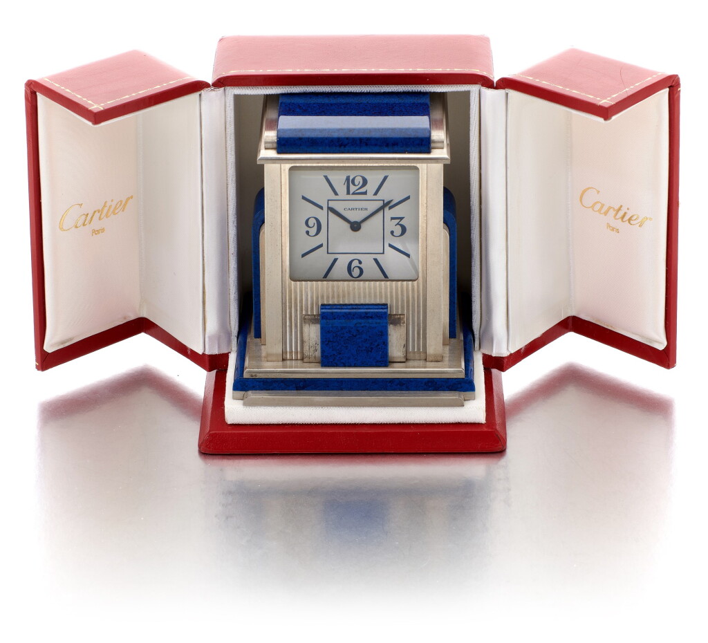 View full screen - View 1 of Lot 181. CARTIER | MYSTERY PRISM DESK TIMEPIECE SILVER-PLATED AND SIMILI-LAPIS LAZULI CLOCK (OROLOGIO DA TAVOLO IN SIMIL-LAPISLAZZULI E PLACCATO ARGENTO).