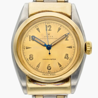 View full screen - View 1 of Lot 719. Reference 6064 'Bubble back' | A yellow gold and stainless steel automatic wristwatch with bracelet, Circa 1949.