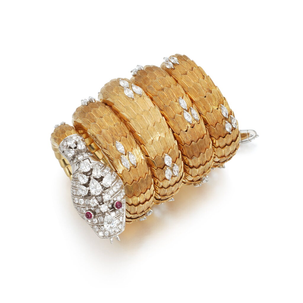 View full screen - View 1 of Lot 581. Lady's gold, ruby and diamond wristwatch, 'Serpenti', circa 1966.