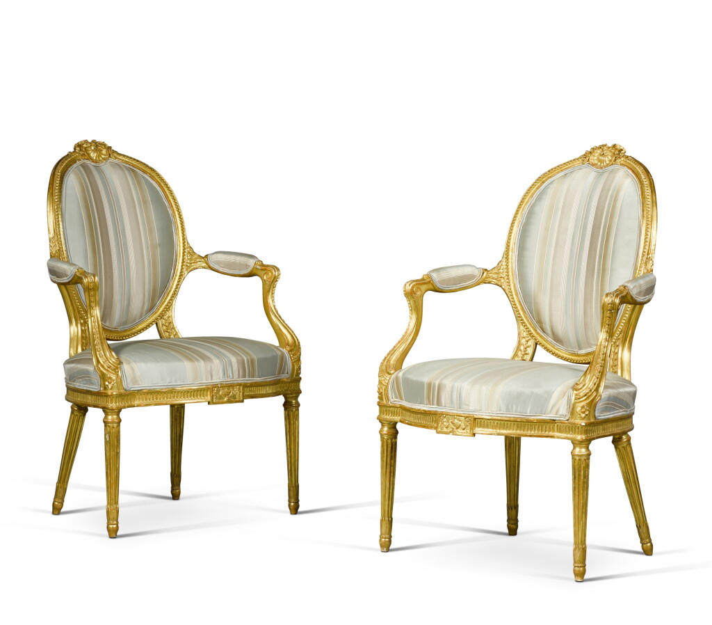 View full screen - View 1 of Lot 114. A pair of George III carved giltwood armchairs, circa 1780.