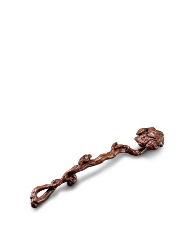 View full screen - View 1 of Lot 3665. A carved sandalwood ruyi sceptre, Qing dynasty, 18th century | 清 檀香木雕靈芝瑞蝠如意.