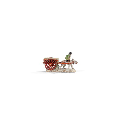 View full screen - View 1 of Lot 732. A rare Ludwigsburg group of a monkey seated on a dog pulling a cart, circa 1765.