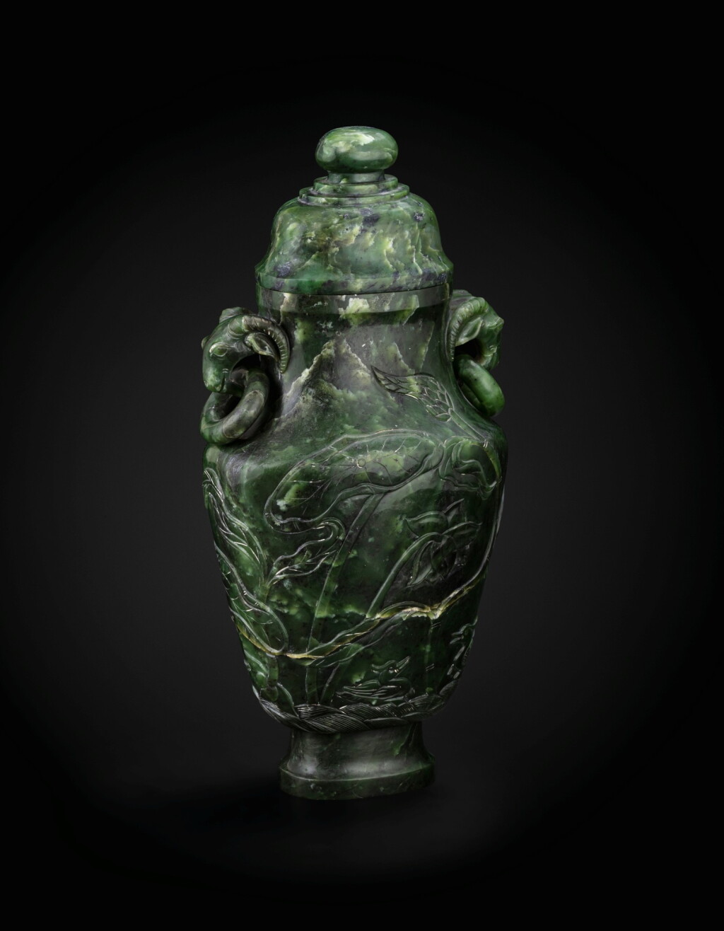 View full screen - View 1 of Lot 108. A large spinach-green jade 'Lotus' vase Qing dynasty, 19th century | 清十九世紀 碧玉荷塘鴛鴦雙羊活環耳蓋瓶.