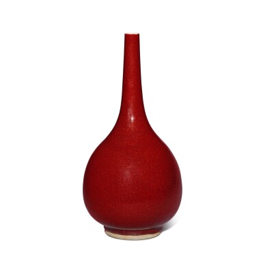 View full screen - View 1 of Lot 531. A copper-red-glazed bottle vase, Qing dynasty, 18th / 19th century | 清十八 / 十九世紀 紅釉長頸瓶.