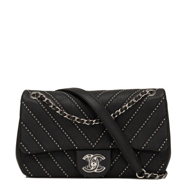 View full screen - View 1 of Lot 83. Chanel Studded Chevron Flap Bag of Black Calfskin with Silver Tone Hardware.