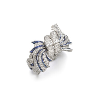 View full screen - View 1 of Lot 943. Sapphire and diamond bangle, circa 1950.