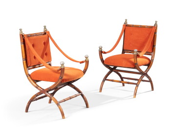 View full screen - View 1 of Lot 106. A pair of a carved walnet armchairs, attributed to Maison Jansen, second half 20th century | Paire de fauteuils curules en noyer, attribué à la Maison Jansen, seconde moitié du XXeme siècle.