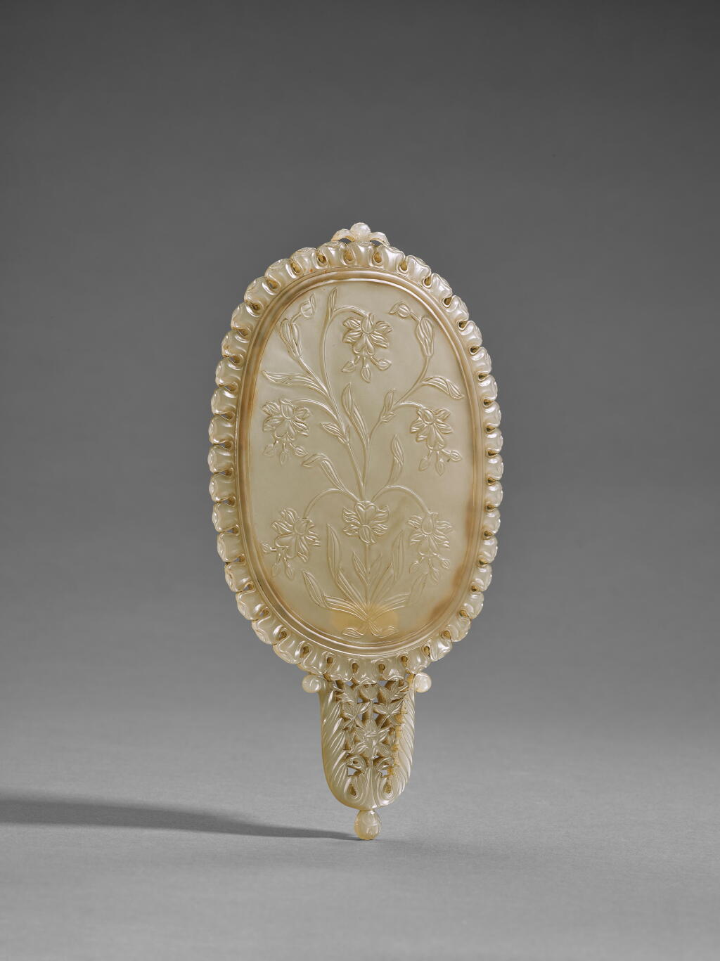 View full screen - View 1 of Lot 172. A Mughal carved jade mirror, India, 18th century.
