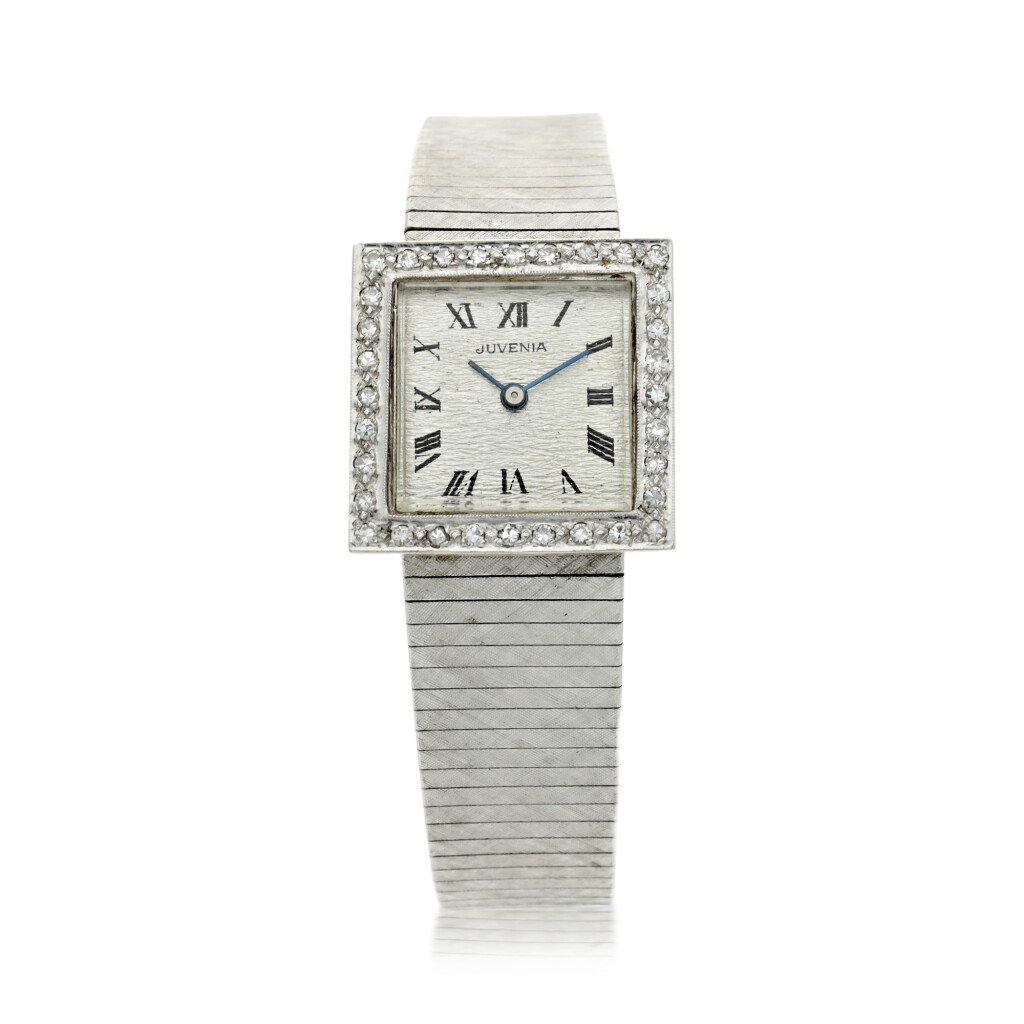 View full screen - View 1 of Lot 38. A LADY'S WHITE GOLD BRACELET WATCH WITH DIAMOND-SET BEZEL, CIRCA 1980.