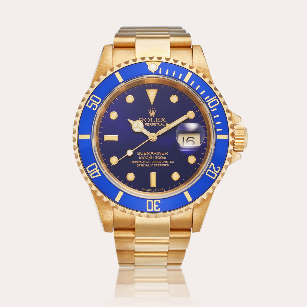 View full screen - View 1 of Lot 172. Reference 16618 Submariner | A yellow gold automatic wristwatch with date and bracelet, Circa 1990.