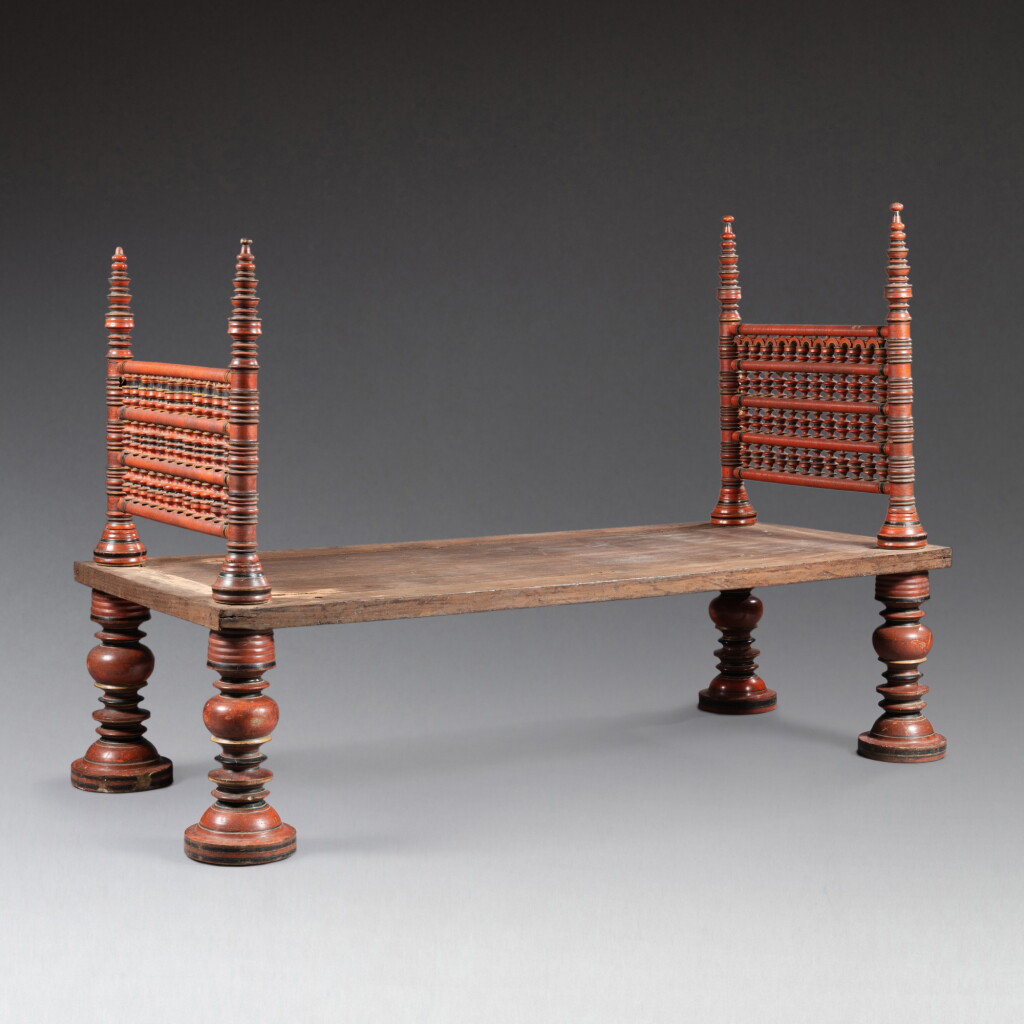 View full screen - View 1 of Lot 88. A South Indian red lacquer bed, 18th century | Lit en bois laqué rouge, Inde du Sud, XVIIIe siècle.