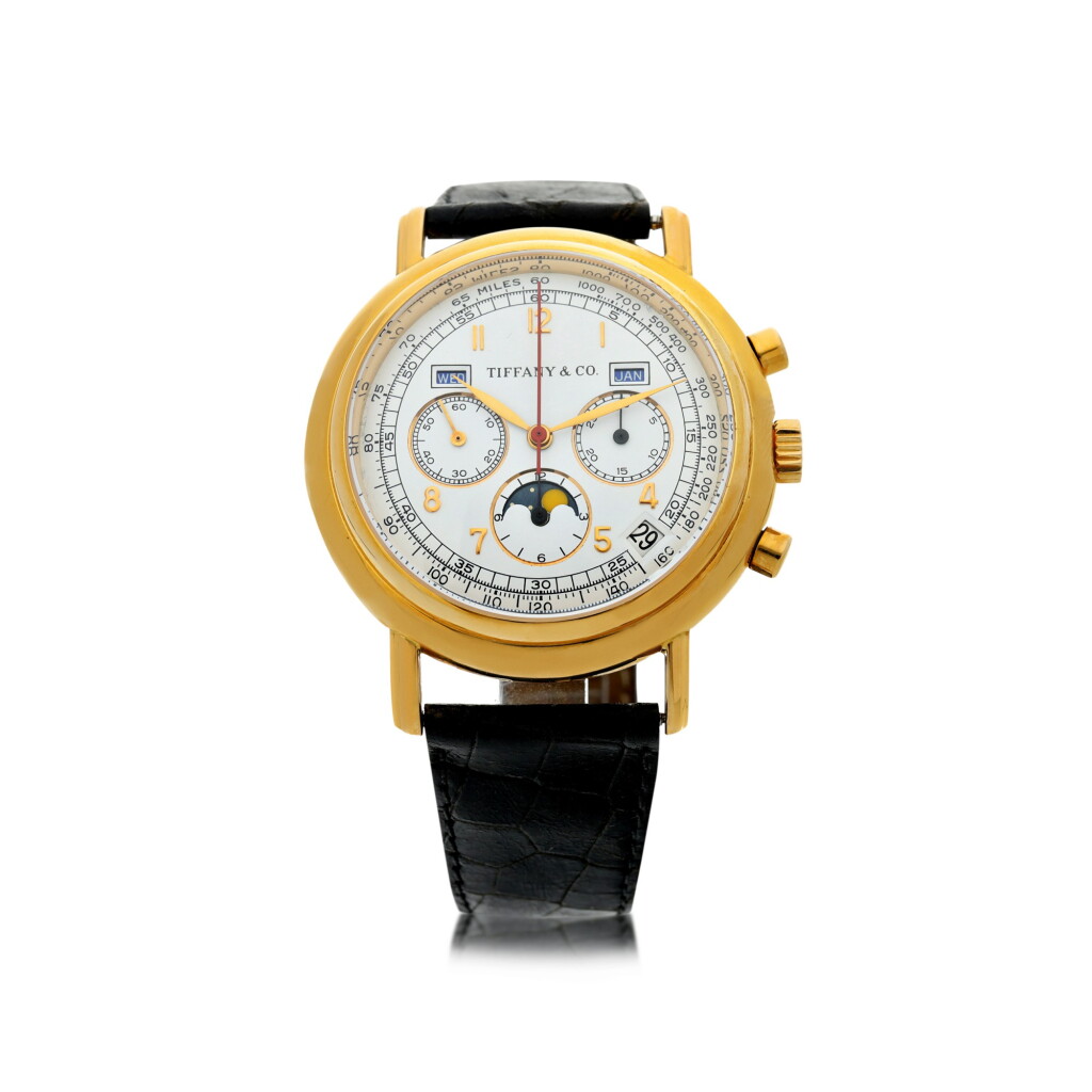 View full screen - View 1 of Lot 13. RETAILED BY TIFFANY & CO.: A YELLOW GOLD AUTOMATIC TRIPLE CALENDAR CHRONOGRAPH WRISTWATCH WITH MOON PHASES, CIRCA 1990.