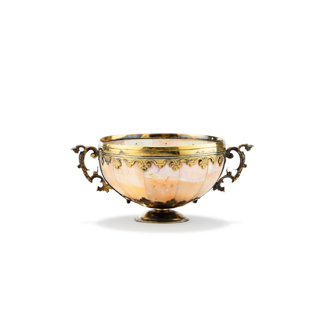 View full screen - View 1 of Lot 132. A silver-gilt mounted mother-of-pearl cup, the cup, Gujarat, circa 1650, the unmarked mounts, probably Germany, circa 1680 | Coupe en nacre et vermeil, la coupe, Gujarat, vers 1650, les montures non-poinçonnées, probablement Allemagne, vers 1680.