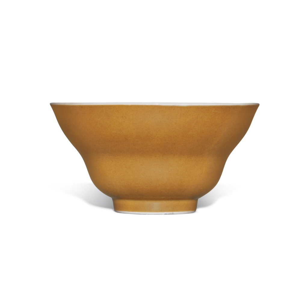 View full screen - View 1 of Lot 387. A café-au-lait-glazed ogee-form bowl, Seal mark and period of Daoguang | 清道光 米黃釉折腰盌 《大清道光年製》款 .