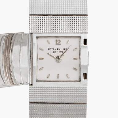 View full screen - View 1 of Lot 129. Reference 3086/14 | A white gold concealed dial bracelet watch, Circa 1950.