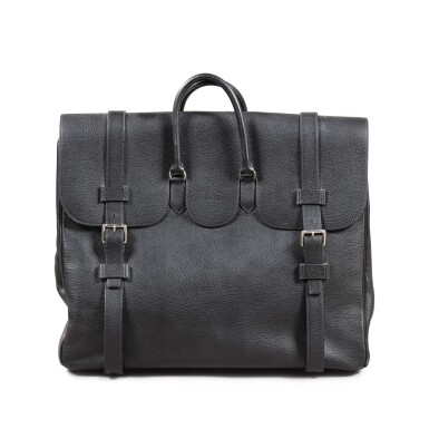 View full screen - View 1 of Lot 32. HERMES Black leather weekend bag palladium hardware | Sac de week-end cuir noir garniture argentée.