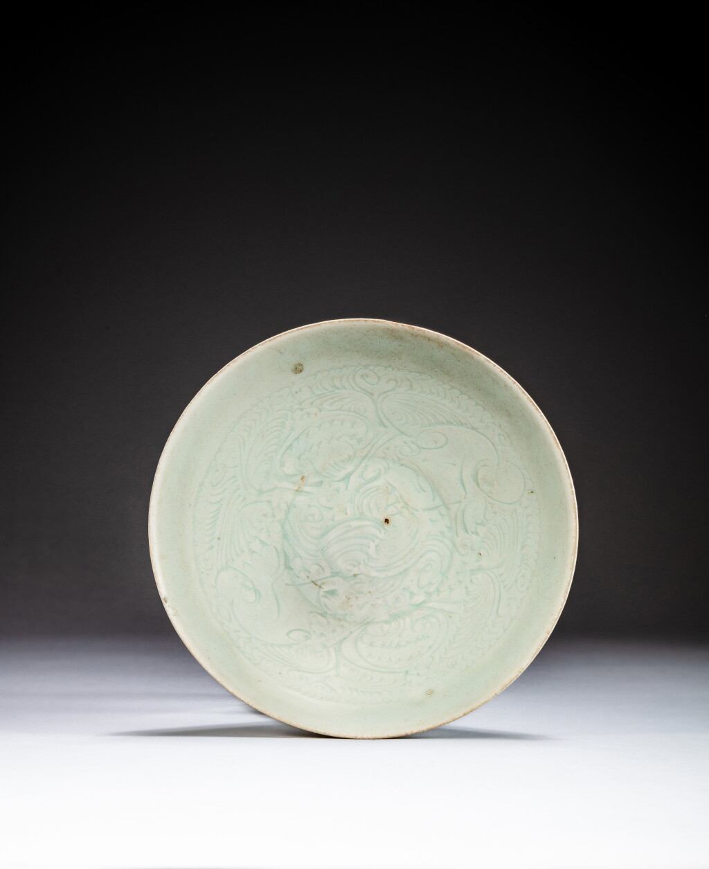 View full screen - View 1 of Lot 39. A carved Qingbai bowl, Song dynasty | 宋 青白釉刻花卉紋盌.