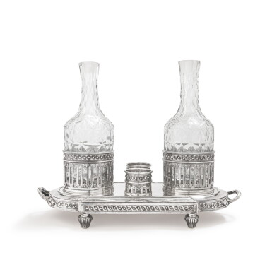 View full screen - View 1 of Lot 457. A large silver cruet, Denys Frankson, Paris, 1780-1781, with two associate glass bottles | Grand huilier en argent par Denys Frankson, Paris, 1780-1781,avec deux carafes en verre rapportées.