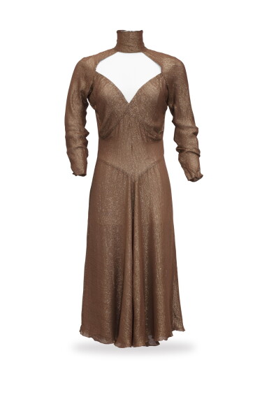 View full screen - View 1 of Lot 75. Marina Lante della Rovere, circa 1974, Muslin and lurex dress with wide décolleté | Robe longue à large décolleté en jersey et lurex.