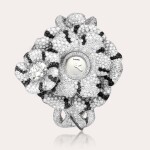 Camélia Secret | A white gold, diamond and black diamond-set bangle watch with concealed dial, Circa 2012