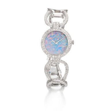 View full screen - View 1 of Lot 951. CHOPARD | REF 2747/1 WHITE GOLD DIAMOND-SET BRACELET WATCH WITH OPAL DIAL CIRCA 1972.