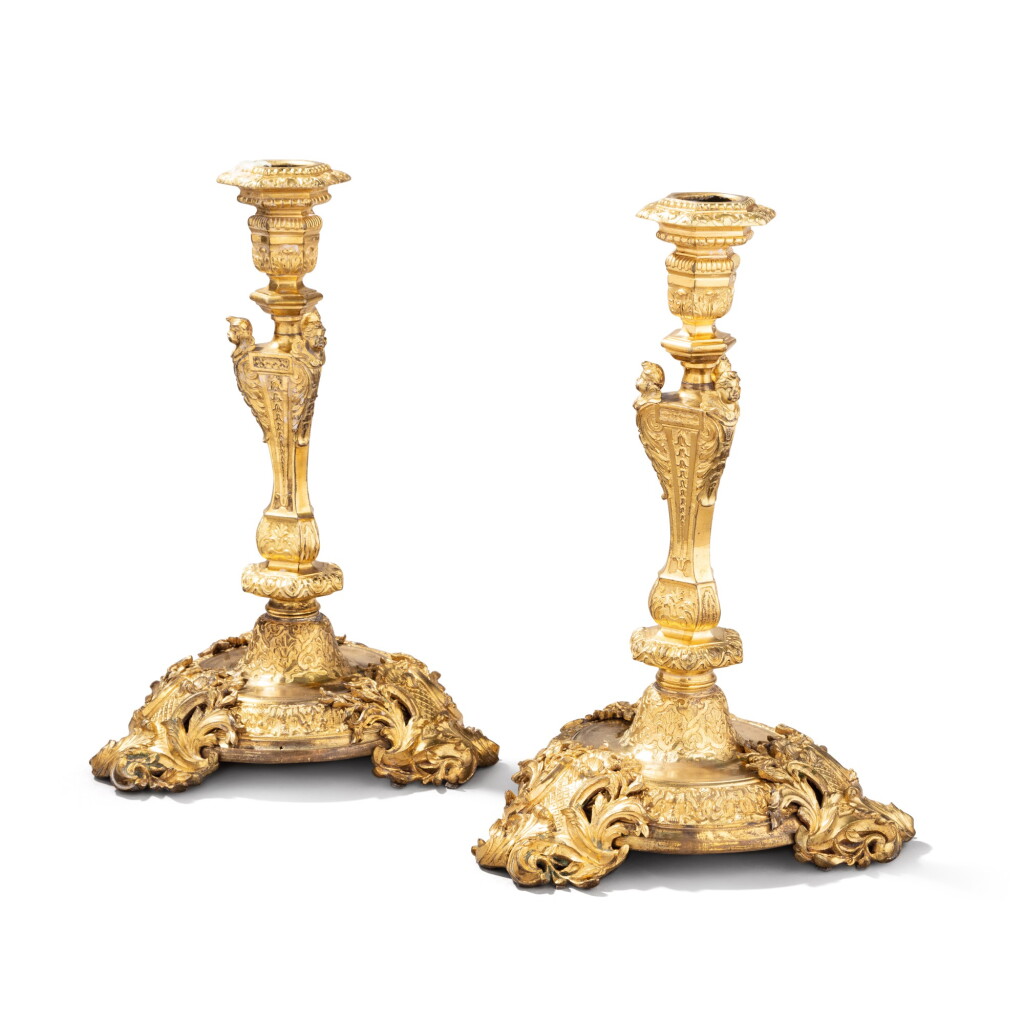 View full screen - View 1 of Lot 536. A pair of Régence gilt-bronze candlesticks, circa 1720, with Louis XV feet, mid-18th century.