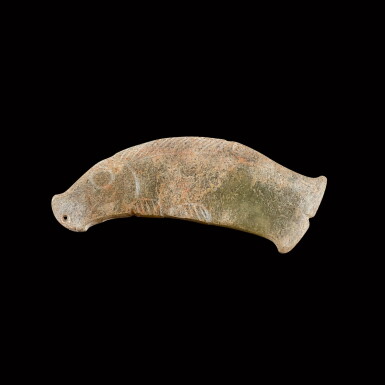 View full screen - View 1 of Lot 134. A celadon jade 'fish' pendant Shang - Western Zhou dynasty | 商至西周 青玉魚形珮.