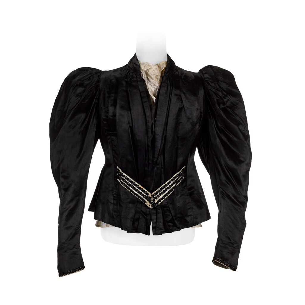 View full screen - View 1 of Lot 2012. A 1970s black satin jacket adapted from an 1890s bodice and a cream cotton Edwardian blouse.