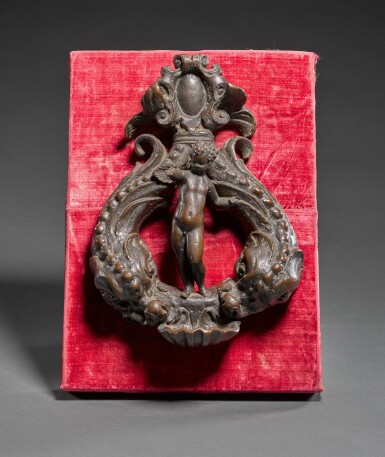 View full screen - View 1 of Lot 30. Doorknocker with a putto and dolphins.