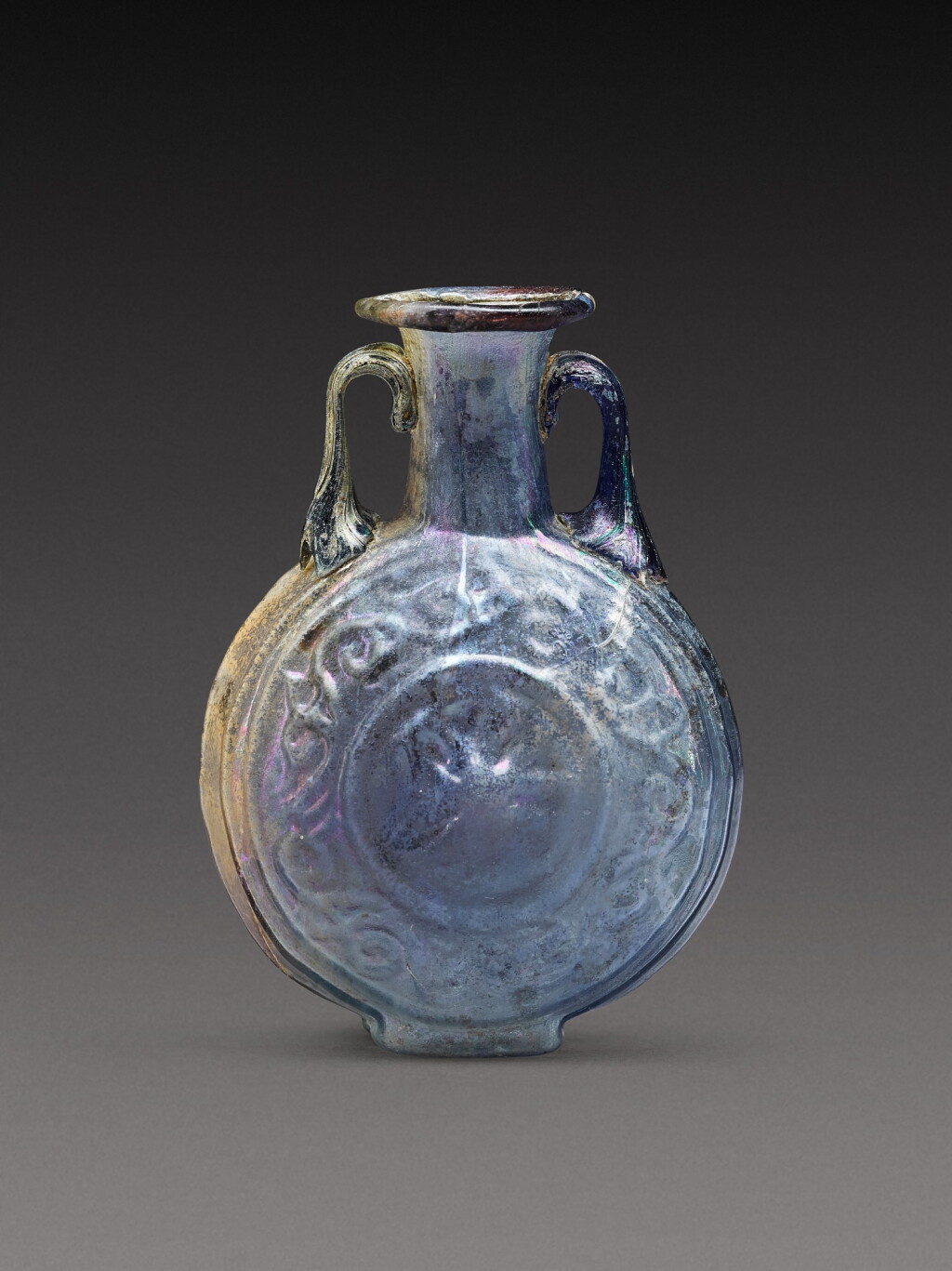 View full screen - View 1 of Lot 6. A Roman Pale Blue Mould-Blown Glass Flask, circa 1st century A.D..