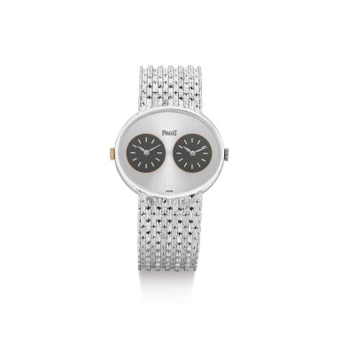 View full screen - View 1 of Lot 114. PIAGET | REFERENCE 612501 N35, A WHITE GOLD DUAL TIME ZONE BRACELET WATCH, CIRCA 1975.
