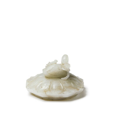 View full screen - View 1 of Lot 129. A celadon jade lotus-form cover with a mandarin duck finial, Ming dynasty.