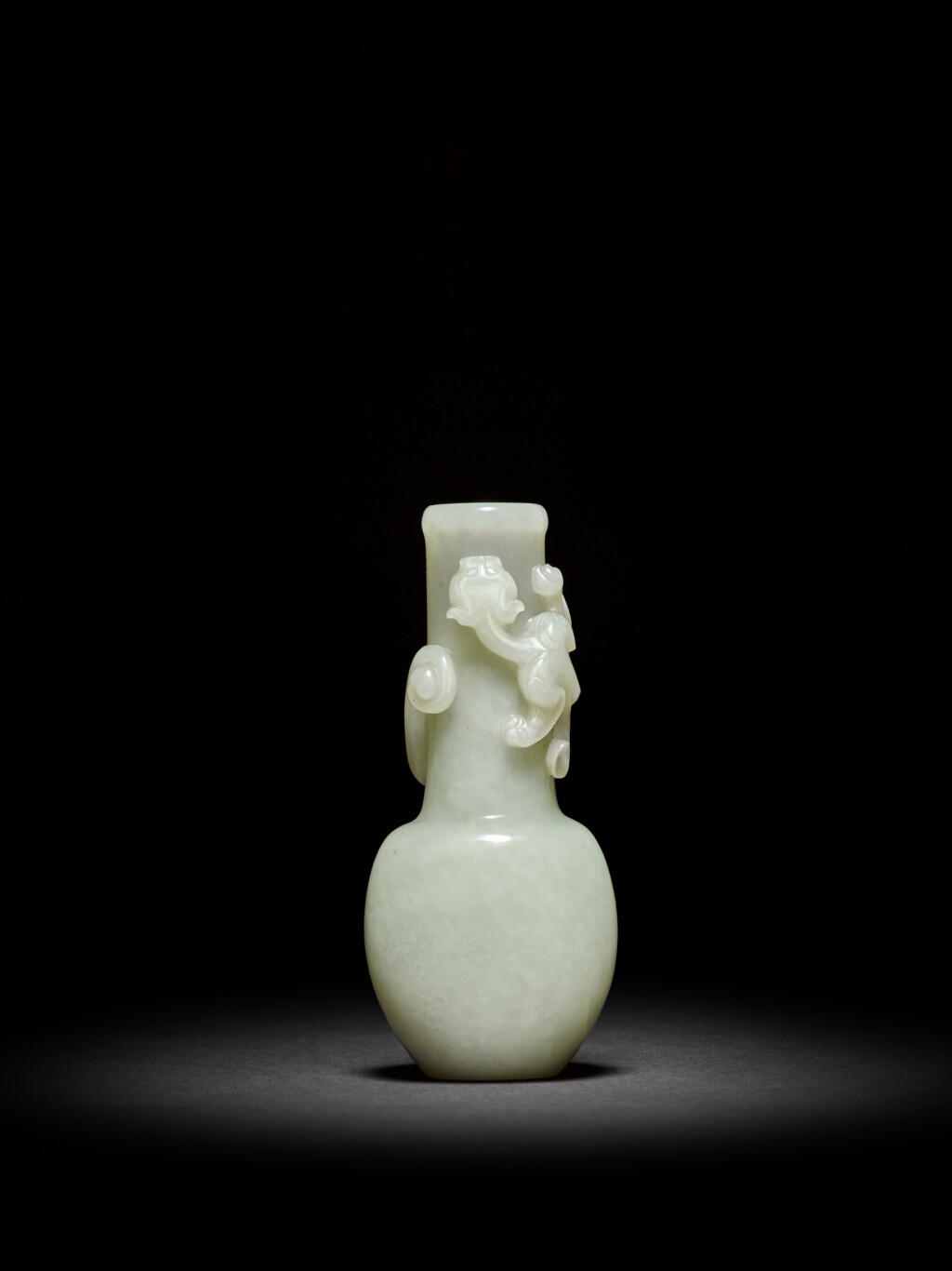 View full screen - View 1 of Lot 14. A small pale celadon jade 'dragon' vase, Qing dynasty, 18th century | 清十八世紀 青白玉雕龍紋瓶.
