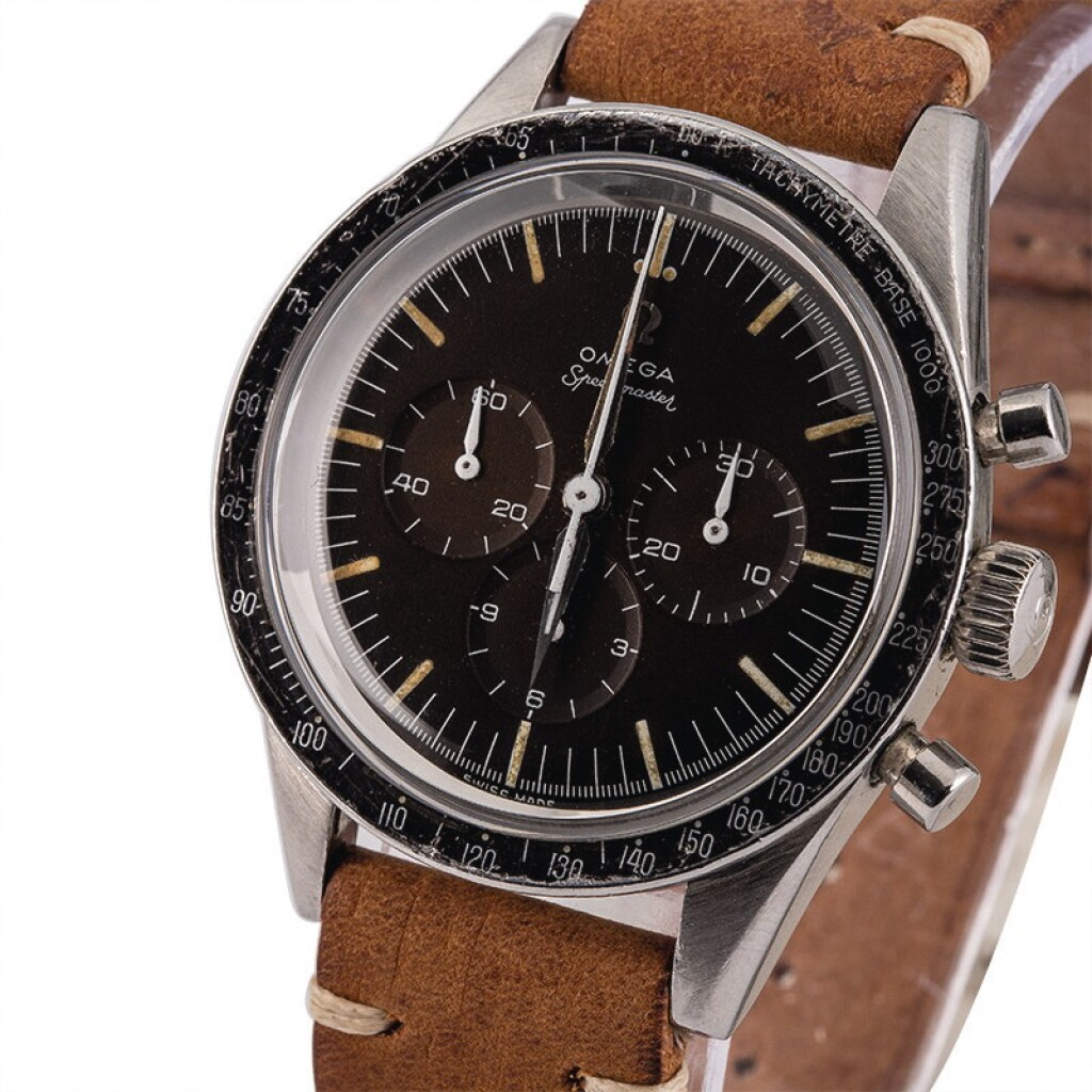 View full screen - View 1 of Lot 16. OMEGA | Speedmaster, Ref. 2998-1, A Stainless Steel Chronograph Wristwatch with “Tropical” Dial, Circa 1960.