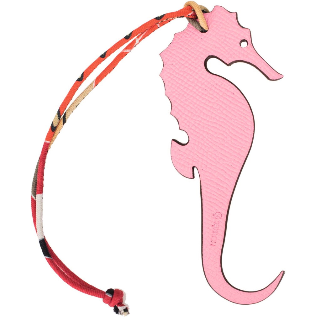 View full screen - View 1 of Lot 14. Hermès Bi-color Rose Confetti Petit H Seahorse Charm in Epsom Leather Reversing to Vermillion Clemence Leather with Multicolor Silk Twill Strap.