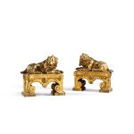 A pair of Louis XVI gilt-bronze lions firedogs, circa 1775, attributed to Philippe Caffieri