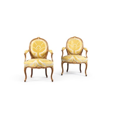 View full screen - View 1 of Lot 52. A pair of Louis XV parcel-gilt beechwood armchairs, circa 1755 | Paire de fauteuils d'époque Louis XV en hêtre rechampi or, vers 1755.