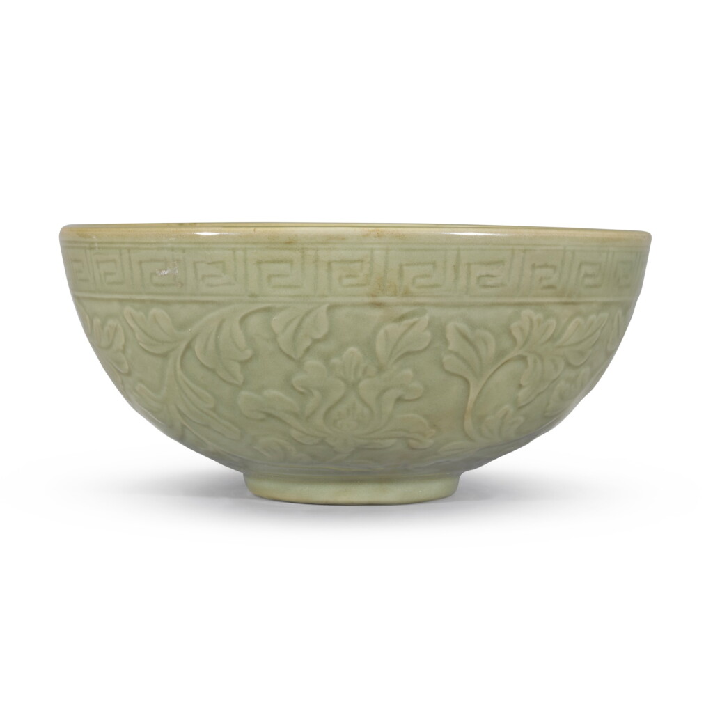 View full screen - View 1 of Lot 111. A large carved Longquan celadon 'lotus' bowl, Ming dynasty, 15th century | 明十五世紀 龍泉窰青釉纏枝蓮紋盌.