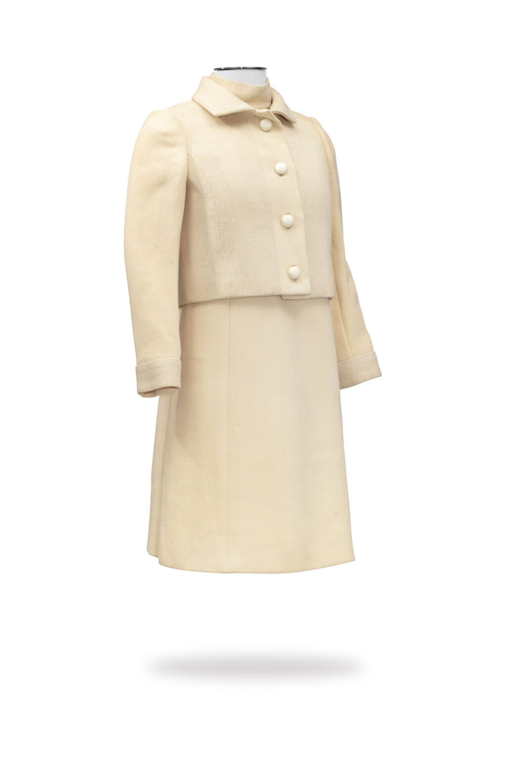 View full screen - View 1 of Lot 60. Roberto Capucci, Haute Couture, circa 1965-1967, Wool dress ornated with a stitched dickey, and matching jacket | Robe à col montant et veste courte en lainage.