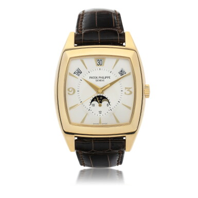View full screen - View 1 of Lot 75. PATEK PHILIPPE | REFERENCE 5135J A YELLOW GOLD TONNEAU FORM AUTOMATIC WRISTWATCH WITH ANNUAL CALENDAR AND MOON PHASES, CIRCA 2005.