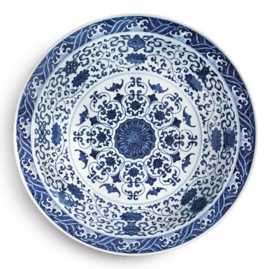 View full screen - View 1 of Lot 148. An extremely rare and large blue and white 'bajixiang' dish, Qianlong seal mark and period | 清乾隆 青花纏枝蓮八吉祥紋大盤 《大清乾隆年製》款.