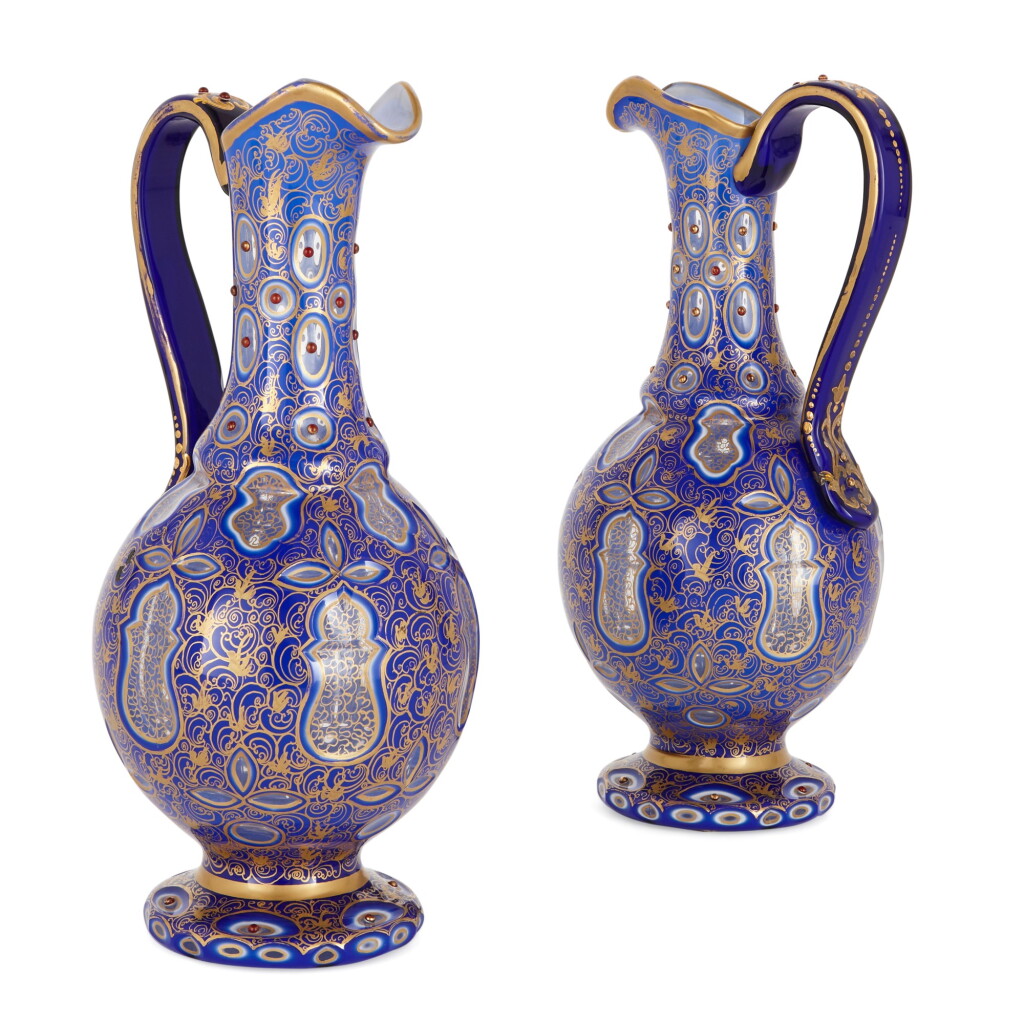 View full screen - View 1 of Lot 84. A PAIR OF BOHEMIAN DOUBLE OVERLAY GLOBULAR EWERS, LATE 19TH CENTURY.