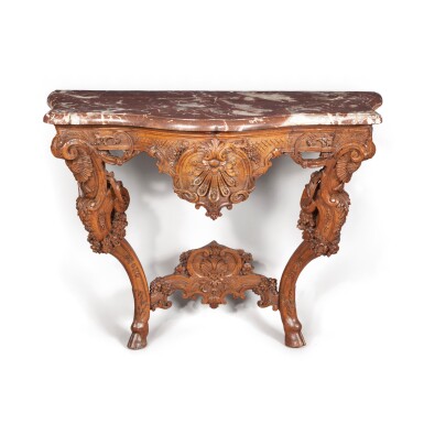 View full screen - View 1 of Lot 46. A rococo carved walnut console, German, probably Würzburg, mid 18th century | Console rococo en noyer sculpté, Allemagne, probablement Würzbourg, milieu du XVIIIeme siècle.
